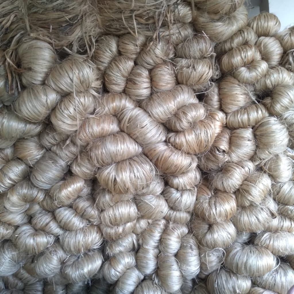 Raw golden jute fibre bundles ready for export bailing